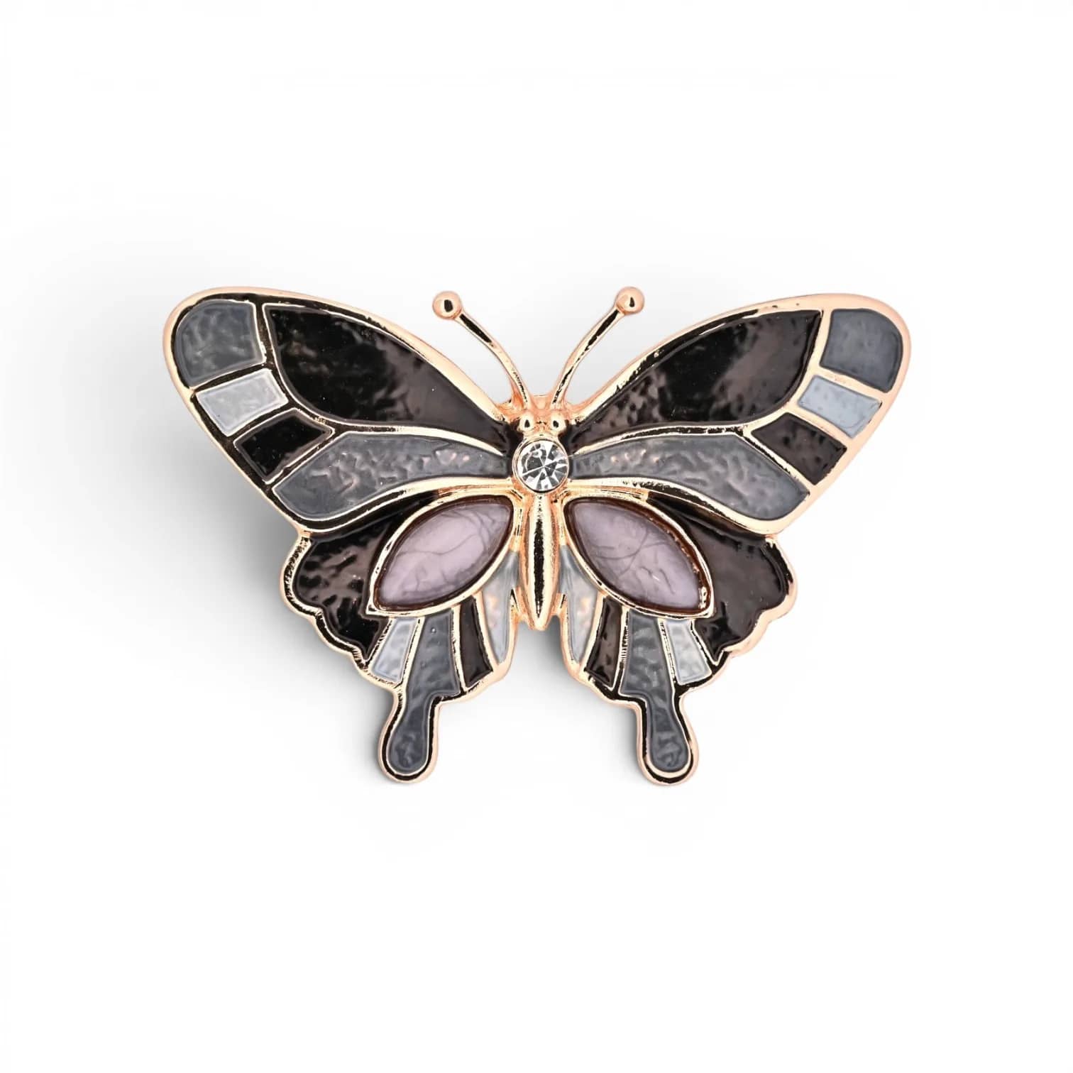 Broche papillon noir et gris dorée aimantée, ailes émaillées noir et gris avec contour doré et cabochons mauves