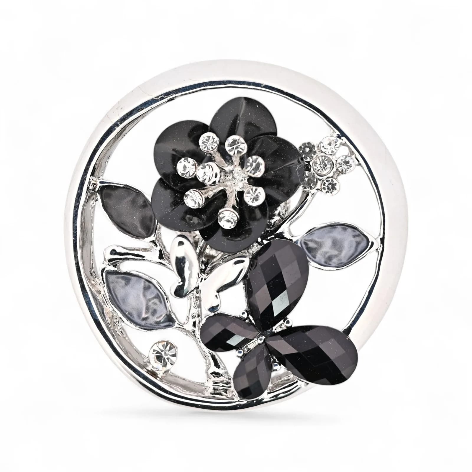 Broche médaillon papillon et fleur noire en acier de couleur argentée
